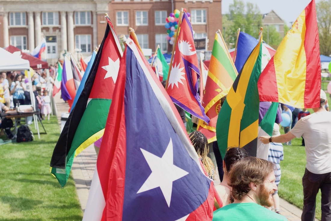 National flags from countries all over the world are displayed by students