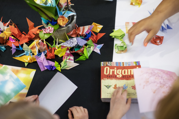 Students from MSU's Japanese Club host an origami station in the student Union