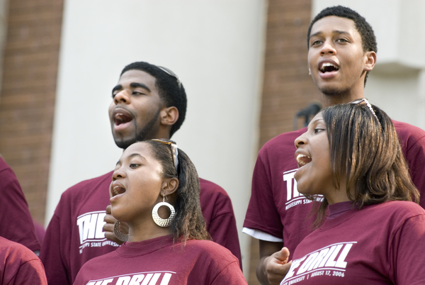 Members of Black Voices sing on the steps of Lee Hall