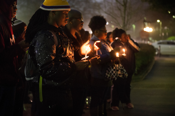 Students take part in a candlelit ceremony to honor Martin Luther King Jr.